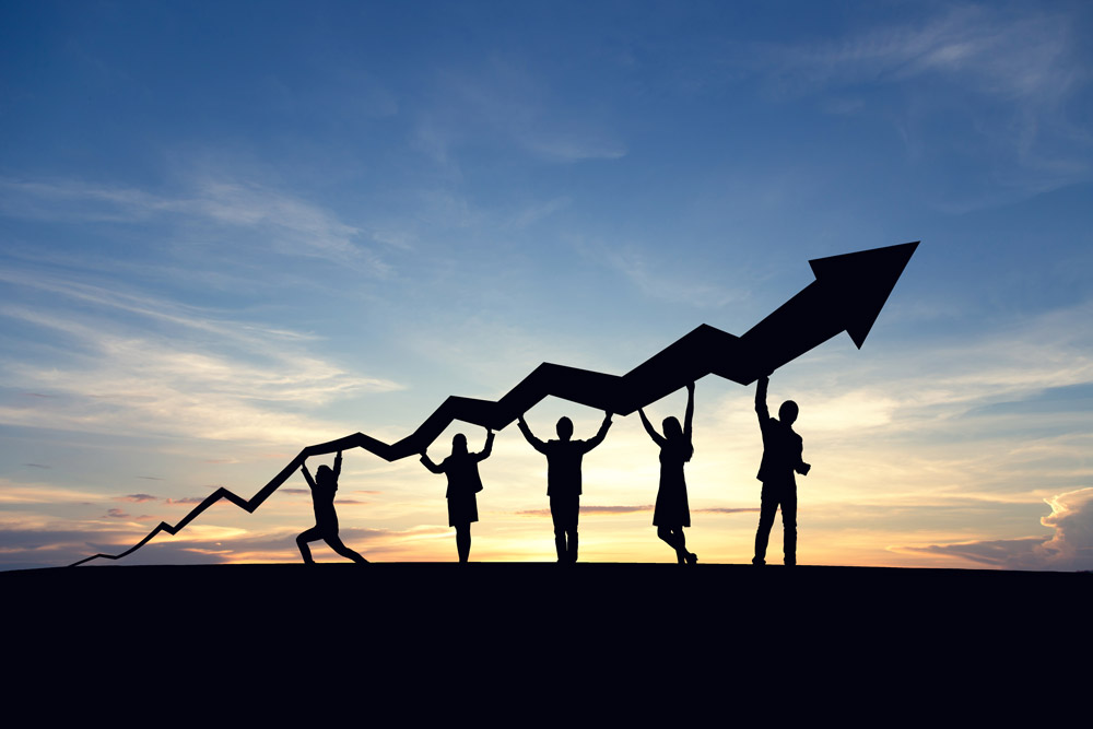 team of businesspeople holding up an arrow of sustained success